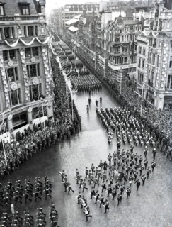 Crowds watching the coronation procession of Queen Elizabeth II, Oxford Circus, London, 2 June 1953. Creator: Arthur Charles Kirby Ware.