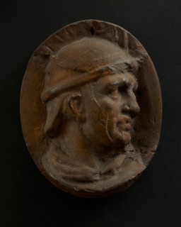 Cast of head of Roman auxiliary in round helmet. Creator: Unknown.