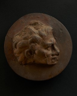 Cast of head of man with hair that springs off brow in thick tufts. Creator: Unknown.