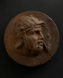 Cast of head of barbarian auxiliary with moustache in helmet. Creator: Unknown.