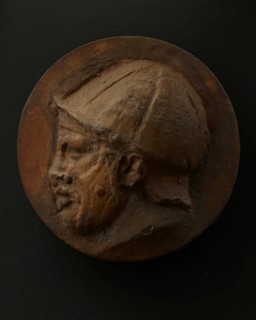 Cast of head of deceased or sleeping Roman auxiliary in helmet. Creator: Unknown.