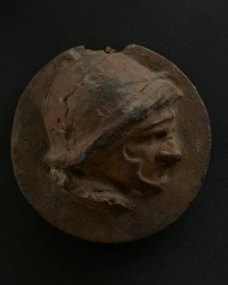 Cast of foreshortened head of Roman soldier in helmet. Creator: Unknown.