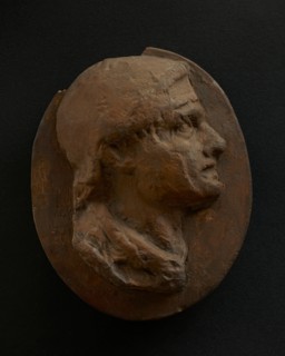 Cast of head of Roman soldier with creased brow. Creator: Unknown.