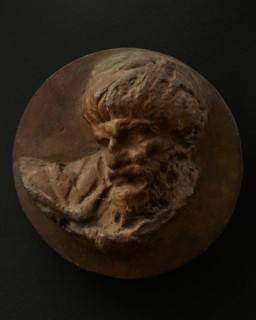 Cast of the head of a Dacian man looking down and to his right. Creator: Unknown.