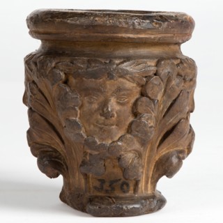 Cast of a medieval capital with leaf foliage and faces, possibly representing the Green Man, c1870. Creator: Unknown.