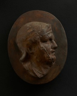 Cast of head of Roman soldier in helmet with bulging brow. Creator: Unknown.