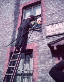 Tutti Man claiming a kiss, Hocktide Festival, Hungerford, Berkshire, c1955. Creator: Arthur Charles Kirby Ware.