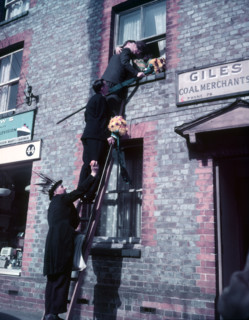 Tutti Men claiming a kiss, Hocktide Festival, Hungerford, Berkshire, c1955. Creator: Arthur Charles Kirby Ware.