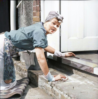 Charlady scrubbing steps, c1955. Creator: Arthur Charles Kirby Ware.