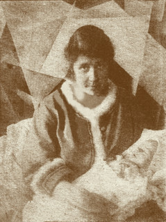 Portrait of Liubov Popova with her son in her studio, 1919. Creator: Anon.