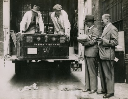 Sir Walter Lamb and Zhuang Shangyan (Chuang Shang-yen) checking cases as they arrive at..., 1935.  Creator: Topical Press Agency.