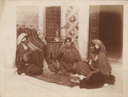 Three young women sitting by a doorway, Tunis, c1910. Ernst Heinrich Landrock, (1878-1966) Creator: Lehnert & Landrock.