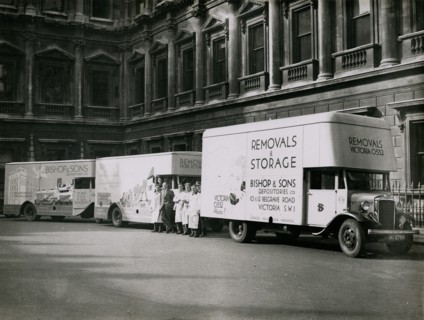 Sir Walter Lamb with vans and staff from Bishop & Sons Depositories outside Burlington House, 1935. Creator: Topical Press Agency.
