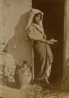 Young woman holding spindles, probably Taormina, Sicily, c1890s. Creator: Count Wilhelm von Gloeden.