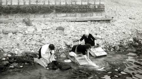 Women washing clothes on the shore of Lago Maggiore, Isola Bella, Italy, c1955.  Creator: Arthur Charles Kirby Ware.
