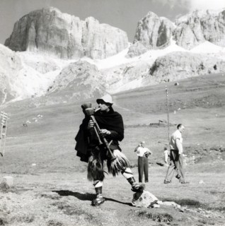 Man in traditional costume playing the zampogna (bagpipes), Sasso Pordoi, Dolomites, Italy, c1955. Creator: Arthur Charles Kirby Ware.