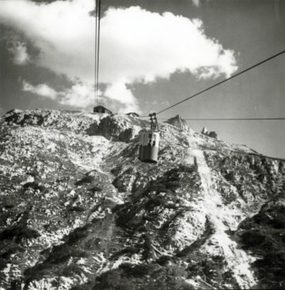 Cable car going up to Tondi di Faloria above Cortina, Dolomites, Italy, c1955.  Creator: Arthur Charles Kirby Ware.