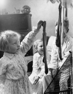 Children hanging up Christmas stockings, c1955. Creator: Arthur Charles Kirby Ware.