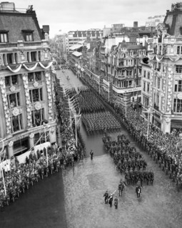 Crowds watching the coronation procession of Queen Elizabeth II, Oxford Circus, London, 2 June 1953. Creator: Arthur Charles Kirby Ware.