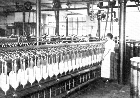 Slubbing, during which the slivers are drawn out still more, and are wound on bobbins, 1909.  Creator: Unknown.