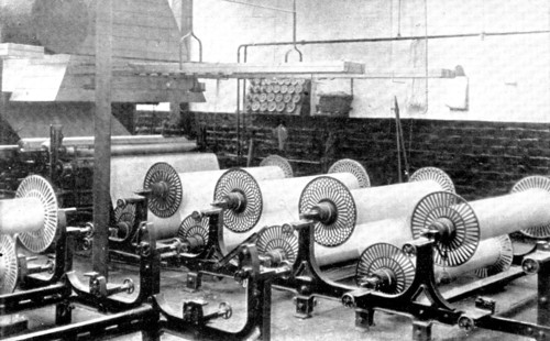 Sizing, which prepares and strengthens the yarns for the process of weaving, 1909.  Creator: Unknown.