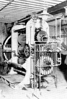 Rubber heels in the making: an elaborate calendering machine which flattens the raw rubber..., 1909. Creator: Unknown.