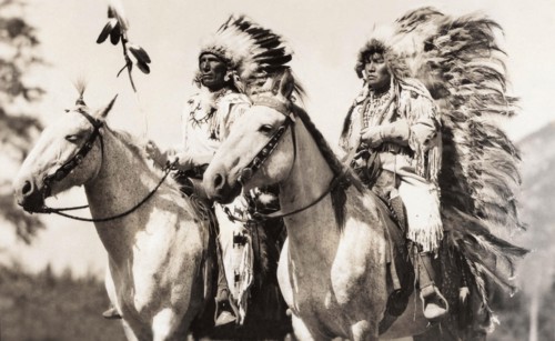Stoney Indian and Squaw on horseback