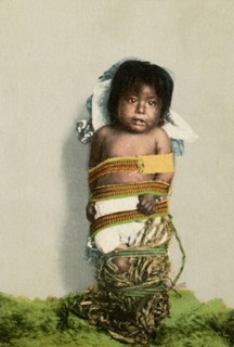 Postcard representing a tied Indian child 
1902