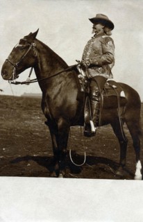 Photo card representing Buffalo Bill on horseback