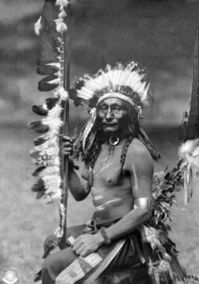 Photo card representing a sitting Indian
