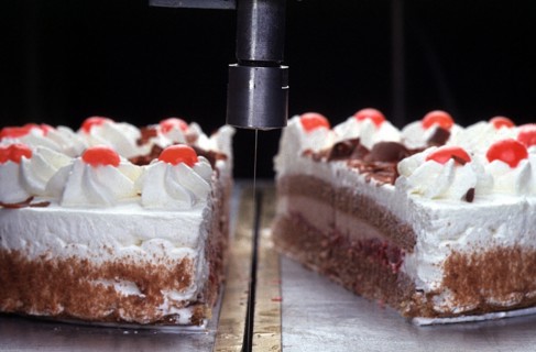Water spray cutting a cake
