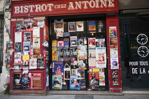 Avignon, shop window covered with theatre posters