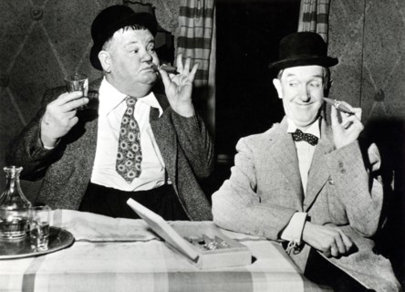 Stan LAUREL and Oliver HARDY with cigars