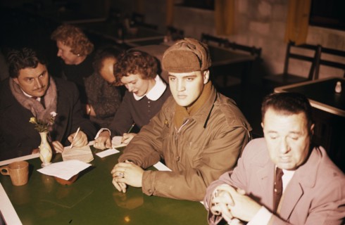 Elvis PRESLEY as a soldier during a press conference, 1958
