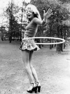 young woman playing the hula hoop
