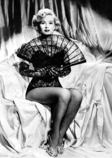 Zsa Zsa GABOR with fan and fishnet stockings