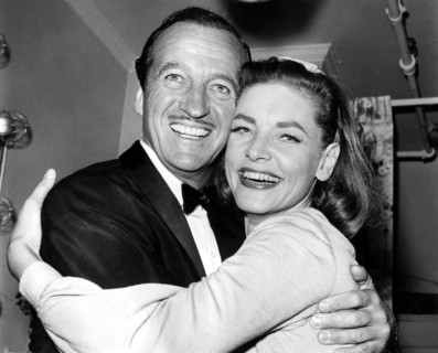 David NIVEN and Lauren BACALL, hugging