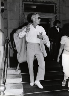 Paul NEWMAN with garment bag