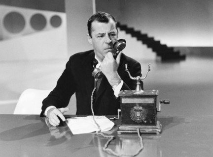 Chris HOWLAND with telephone during a television program