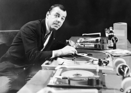 Chris HOWLAND in front of record players, undated