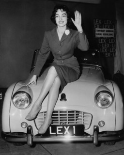 Petra SCHÜRMANN sits on a Triumph TR3, London 1956