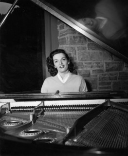 Jane RUSSELL at a grand piano, undated