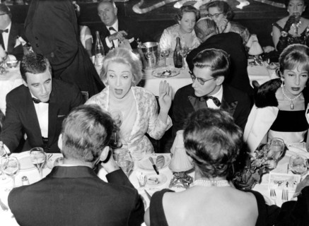 Marlene DIETRICH with Yves SAINT LAURENT at Maxim's, 1959