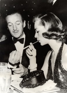 David NIVEN and Lauren BACALL at a party