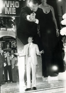Roger MOORE in front of a 'James Bond' cinema poster, Cannes 1977