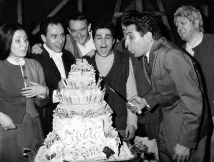 Gilbert BÉCAUD with birthday cake, Paris 1962