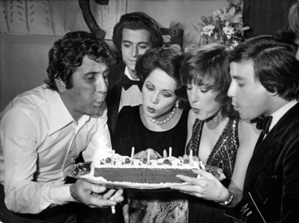 Gilbert BÉCAUD with birthday cake, Paris 1977
