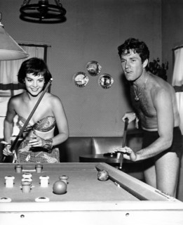 Natalie WOOD and Hugh O'BRIAN playing a game of billiards