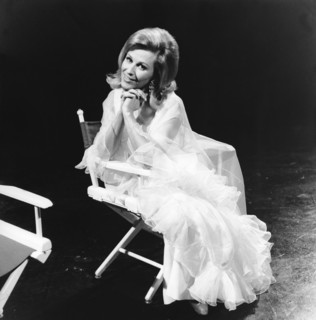 Bibi JOHNS in a director's chair