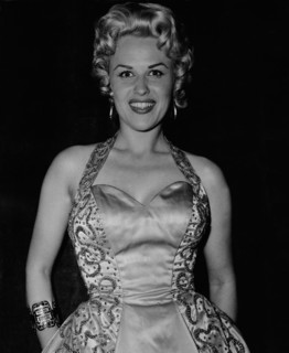 Bibi JOHNS in an evening dress for a celebratory occasion
